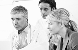 Clinical research professionals reviewing study materials